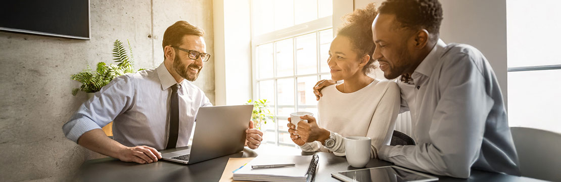 A couple having a meeting with an advisor.